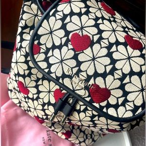 Kate Spade never used backpack with dust bag. Medium size black, white & red
